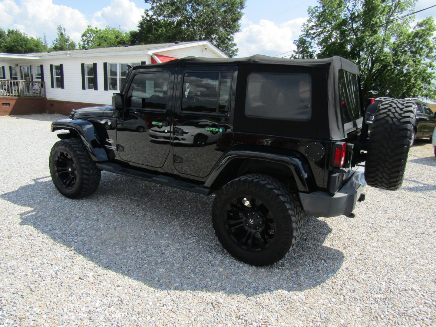 2015 Black /Tan Jeep Wrangler (1C4HJWEG4FL) with an V6 engine, Automatic transmission, located at 15016 S Hwy 231, Midland City, AL, 36350, (334) 983-3001, 31.306210, -85.495277 - Photo#5